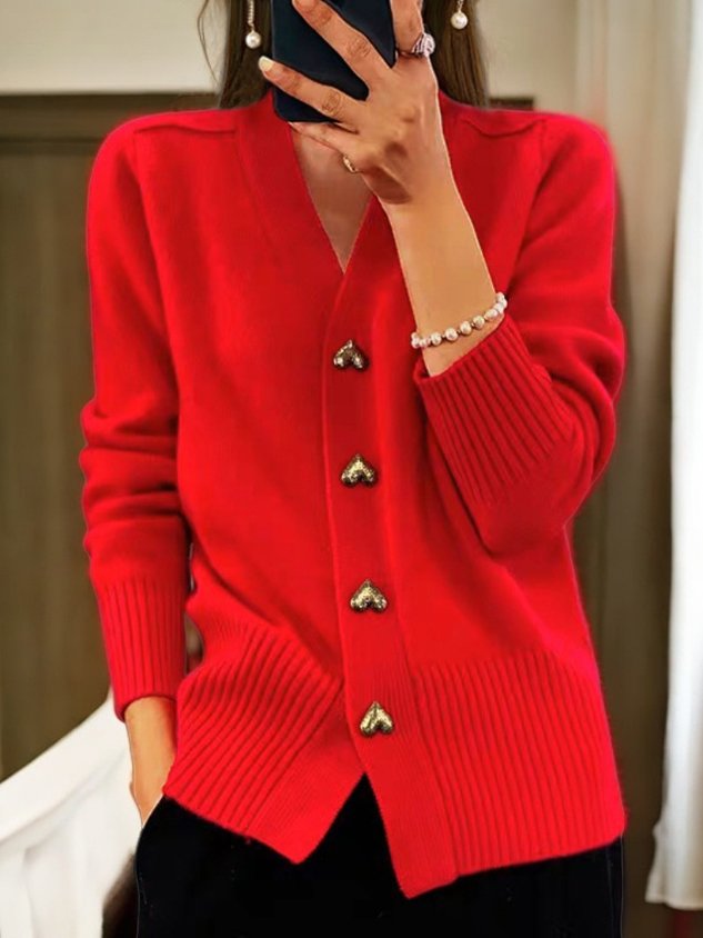 Everly red V-neck cardigan with heart-shaped button details, close-up