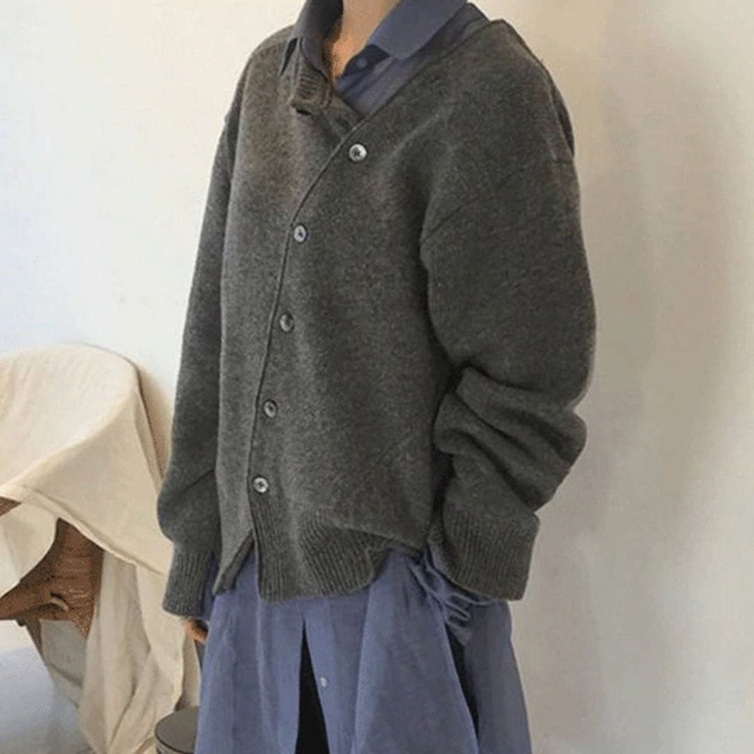 Nora oversized asymmetric cardigan in gray, side profile styled with a blue shirt dress