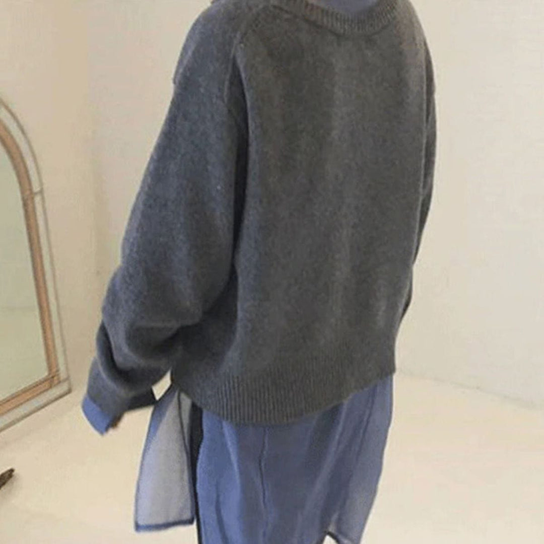 Nora asymmetric button cardigan in gray, back view layered over a blue shirt dress
